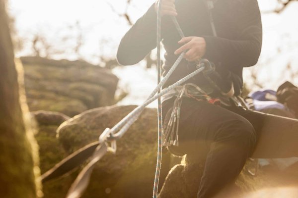 How should you handle a sudden tire blowout on a busy UK motorway?